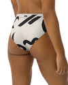 The Cool Ppl strokes in black and off white, high waisted bikini bottom from the Modern Lines swim collection side back view